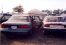 Getting ready to go home.  Our lovely cars and tent.