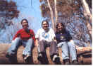 Jamie Johnston, Melissa Barth, and me sitting on the downed tree/"bridge" over the stream.